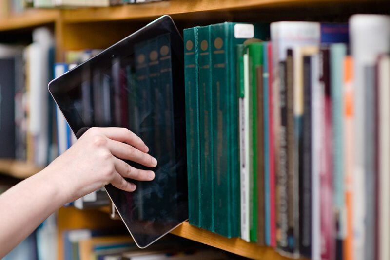 iPad in a bookshelf