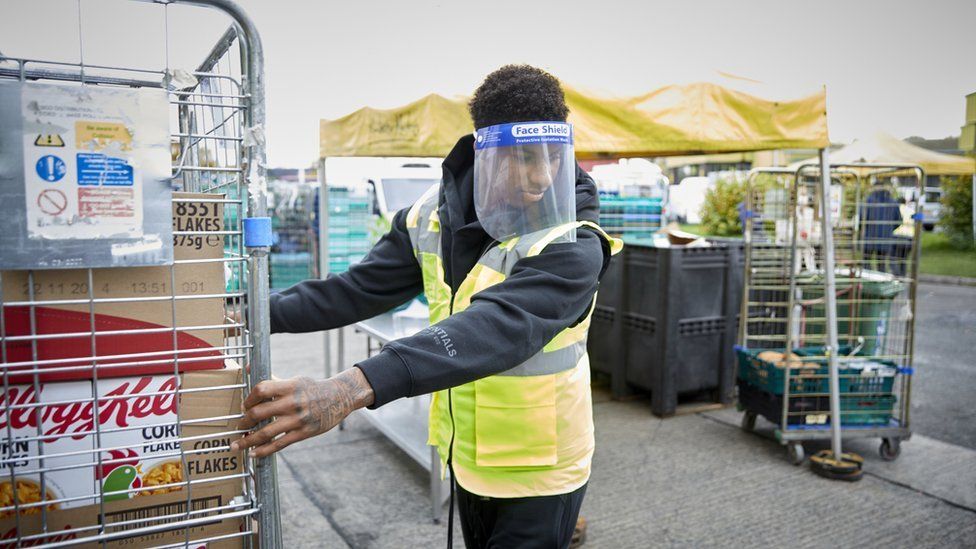 Marcus Rashford in PPE equipment working at food bank