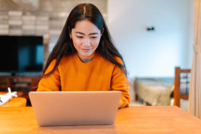 Student working on their computer at home