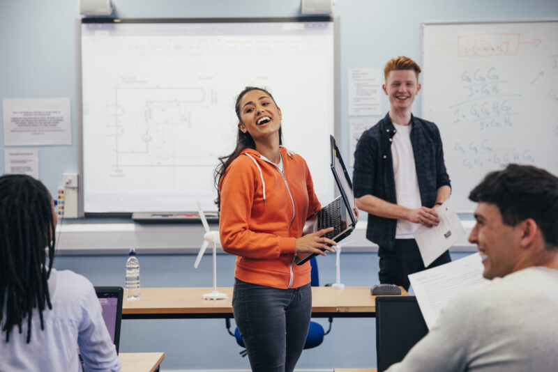Student in front of science class