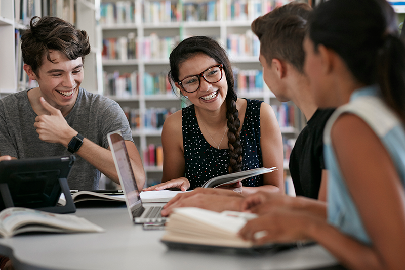 Students in a group smiling